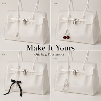 White Jelly Tote styled with four charms